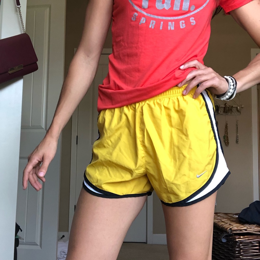 Yellow Nike tempo shorts